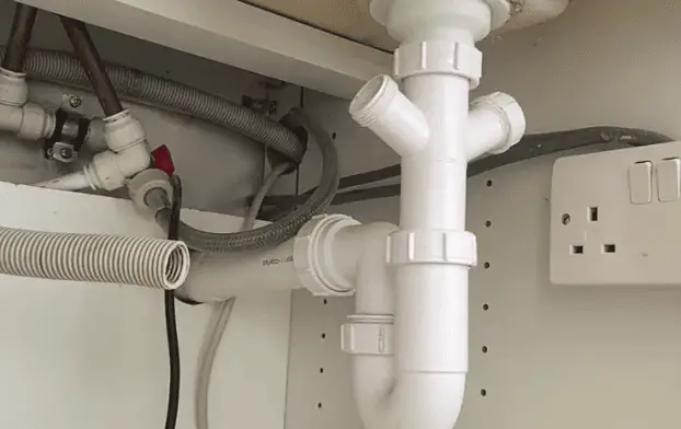 White dishwasher with removed pipe