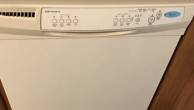 white colored dishwasher with buttons on top